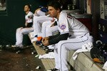 NEW YORK - APRIL 21:  Jeff Francoeur #12 of the New York Mets looks on from the bench during their game against the Chicago Cubs on April 21, 2010 at Citi Field in the Flushing neighborhood of the Queens borough of New York City.  The Cubs defeated the Mets 9-3.  (Photo by Mike Stobe/Getty Images)