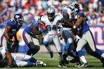 EAST RUTHERFORD, NJ - OCTOBER 17: Kevin Smith #34 of the Detroit Lions runs the ball against the New York Giants at New Meadowlands Stadium on October 17, 2010 in East Rutherford, New Jersey. The Giants defeated the Lions 28 - 20. (Photo by Andrew Burton/Getty Images)