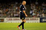 MELBOURNE, AUSTRALIA - JANUARY 22:  Kevin Muscat of the Victory leaves the field looking dejected following his red card during the round 24 A-League match between the Melbourne Victory and the Melbourne Heart at Etihad Stadium on January 22, 2011 in Melbourne, Australia.  (Photo by Graham Denholm/Getty Images)