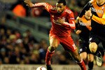LIVERPOOL, ENGLAND - DECEMBER 15:  Ryan Babel of Liverpool is pursued by Michael Silberbauer of FC Utrecht during the UEFA Europa League Group K match between Liverpool and FC Utrecht at Anfield on December 15, 2010 in Liverpool, England.  (Photo by Clint Hughes/Getty Images)