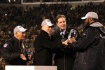 PITTSBURGH, PA - JANUARY 23:  Owner Dan Rooney (L), Team president Art Rooney II (2ndL),  and head coach Mike Tomlin (R) of the Pittsburgh Steelers recieve the Lamar Hunt Trophy as CBS sportscaster Jim Nantz looks on after their 24 to 19 win over the New York Jets in the 2011 AFC Championship game at Heinz Field on January 23, 2011 in Pittsburgh, Pennsylvania.  (Photo by Al Bello/Getty Images)
