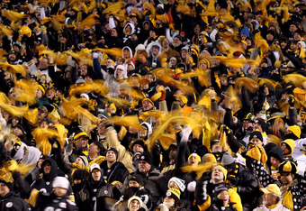 PITTSBURGH, PA - JANUARY 23:  Pittsburgh Steelers fans wave terrible towels during their 2011 AFC Championship game against the New York Jets at Heinz Field on January 23, 2011 in Pittsburgh, Pennsylvania.  (Photo by Al Bello/Getty Images)