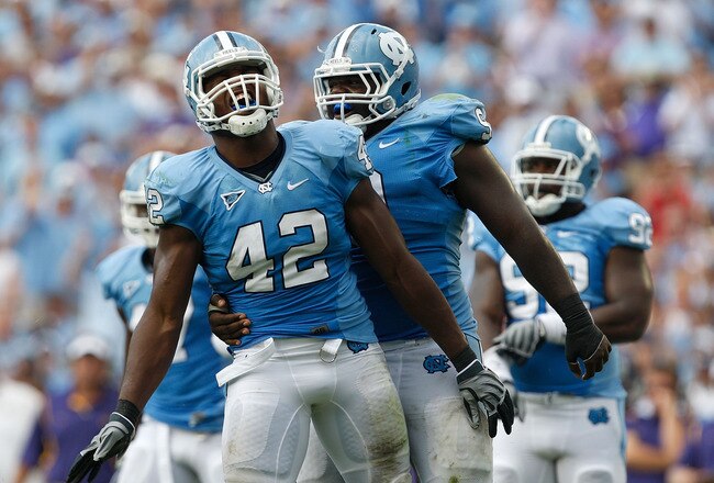 CHAPEL HILL, NC - SEPTEMBER 19:  Robert Quinn #42 of the North Carolina Tar Heels celebrates after a sack with teammate Marvin Austin #9 against the East Carolina Pirates at Kenan Stadium on September 19, 2009 in Chapel Hill, North Carolina.  (Photo by Streeter Lecka/Getty Images)