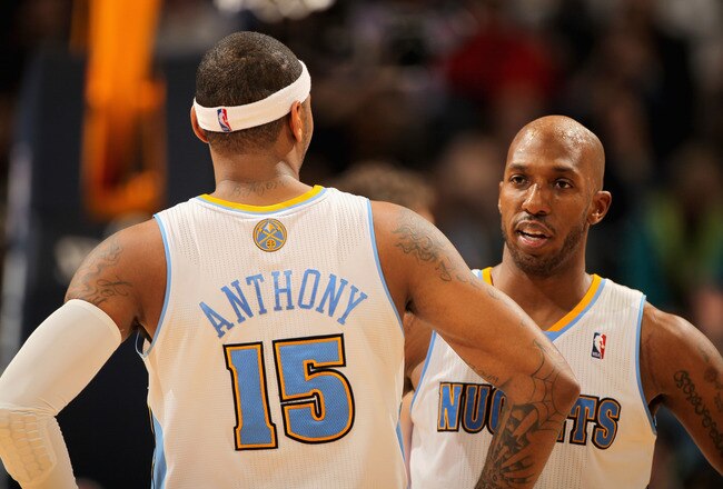 DENVER, CO - JANUARY 21:  Carmelo Anthony #15 and Chauncey Billups #1 of the Denver Nuggets talk during a break in the action against the Los Angeles Lakers at the Pepsi Center on January 21, 2011 in Denver, Colorado. The Lakers defeated the Nuggets 107-97. NOTE TO USER: User expressly acknowledges and agrees that, by downloading and or using this photograph, User is consenting to the terms and conditions of the Getty Images License Agreement.  (Photo by Doug Pensinger/Getty Images)