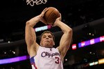 LOS ANGELES, CA - JANUARY 05:  Blake Griffin #32 of the Los Angeles Clippers grabs a rebound against the Denver Nuggets at Staples Center on January 5, 2011  in Los Angeles, California. The Clippers won 106-93.  NOTE TO USER: User expressly acknowledges and agrees that, by downloading and or using this photograph, User is consenting to the terms and conditions of the Getty Images License Agreement.  (Photo by Stephen Dunn/Getty Images)