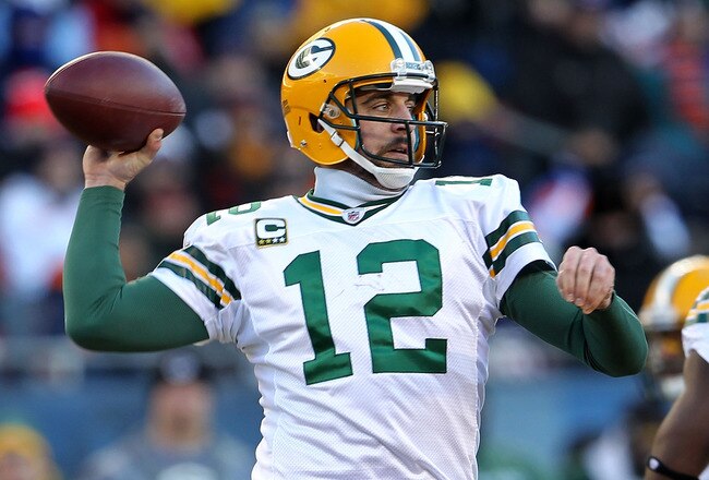 CHICAGO, IL - JANUARY 23:  Quarterback Aaron Rodgers #12 of the Green Bay Packers looks to pass against the Chicago Bears in the NFC Championship Game at Soldier Field on January 23, 2011 in Chicago, Illinois.  (Photo by Jamie Squire/Getty Images)