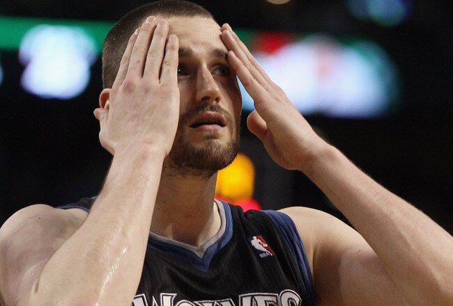 BOSTON, MA - JANUARY 03:  Kevin Love #42 of the Minnesota Timberwolves wipes his face in the fourth quarter against the Boston Celtics on January 3, 2011 at the TD Garden in Boston, Massachusetts. The Celtics defeated the Timberwolves 96-93. NOTE TO USER: User expressly acknowledges and agrees that, by downloading and/or using this Photograph, User is consenting to the terms and conditions of the Getty Images License Agreement.  (Photo by Elsa/Getty Images)