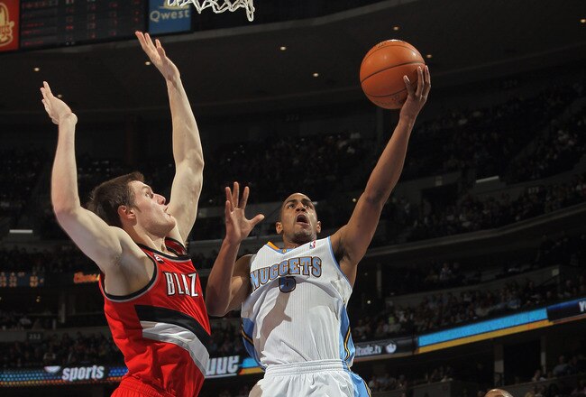 DENVER - DECEMBER 28:  Arron Afflalo #6 of the Denver Nuggets lays up a shot around the defense of Luke Babbit #11 of the Portland Trail Blazers at Pepsi Center on December 28, 2010 in Denver, Colorado. The Nuggets defeated the Blazers 95-77. NOTE TO USER: User expressly acknowledges and agrees that, by downloading and or using this photograph, User is consenting to the terms and conditions of the Getty Images License Agreement.  (Photo by Doug Pensinger/Getty Images)