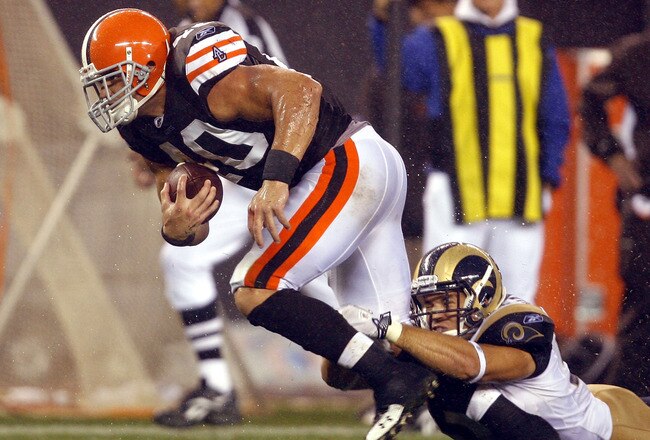 CLEVELAND - AUGUST 21:  Chris Chamberlain #57 of the St. Louis Rams tackles Peyton Hillis #40 of the Cleveland Browns at Cleveland Browns Stadium on August 21, 2010 in Cleveland, Ohio.  (Photo by Matt Sullivan/Getty Images)