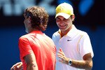 MELBOURNE, AUSTRALIA - JANUARY 16:  Rafael Nadal of Spain and Roger Federer enjoy the day during the 'Rally For Relief' charity exhibition match ahead of the 2011 Australian Open at Melbourne Park on January 16, 2011 in Melbourne, Australia.  (Photo by Julian Finney/Getty Images)