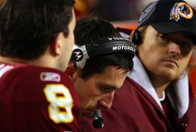 LANDOVER, MD - JANUARY 02:  Offensive coordinator Kyle Shanahan (C) of the Washington Redskins works on the sideline with quarterbacks Rex Grossman #8 and John Beck #3 in the fourth quarter of a game against the New York Giants at FedEx Field on January 2, 2011 in Landover, Maryland. The Giants won the game 17-14.  (Photo by Win McNamee/Getty Images)