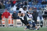EAST HARTFORD, CT - NOVEMBER 27:  Zach Collaros #12 of the Cincinnati Bearcats carries the ball as Sio Moore #46 of the Connecticut Huskies makes the tackle on November 27, 2010 at Rentschler Field in East Hartford, Connecticut. The Huskies defeated the Bearcats 38-17.  (Photo by Elsa/Getty Images)