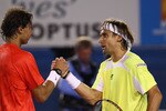 MELBOURNE, AUSTRALIA - JANUARY 26:  Rafael Nadal of Spain congratulates David Ferrer of Spain in his victory in their  quarterfinal match during day ten of the 2011 Australian Open at Melbourne Park on January 26, 2011 in Melbourne, Australia.  (Photo by Clive Brunskill/Getty Images)