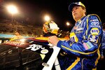 AVONDALE, AZ - NOVEMBER 13:  Michael Waltrip #55 climbs in to his car prior to the NASCAR K&N Pro Series 3 Amigos Tequila 125 at Phoenix International Raceway on November 13, 2010 in Avondale, Arizona.  (Photo by Robert Laberge/Getty Images for NASCAR)