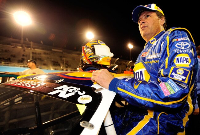 AVONDALE, AZ - NOVEMBER 13:  Michael Waltrip #55 climbs in to his car prior to the NASCAR K&N Pro Series 3 Amigos Tequila 125 at Phoenix International Raceway on November 13, 2010 in Avondale, Arizona.  (Photo by Robert Laberge/Getty Images for NASCAR)