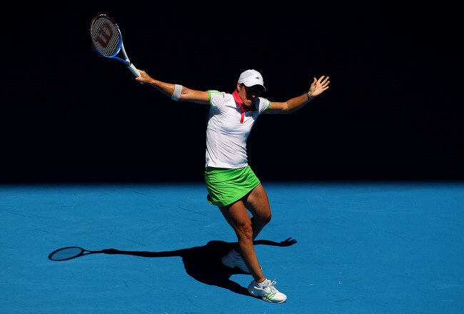 MELBOURNE, AUSTRALIA - JANUARY 21:  Justine Henin of Belgium plays a backhand in her third round match against Svetlana Kuznetsova of Russia during day five of the 2011 Australian Open at Melbourne Park on January 21, 2011 in Melbourne, Australia.  (Photo by Cameron Spencer/Getty Images)