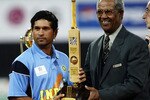 JOHANNESBURG - MARCH 23:   Sachin Tendulkar of India is presented the Man of the Series trophy by Sir Garfield Sobers after the ICC Cricket World Cup Final between India and Australia at The Wanderers, in Johannesburg, South Africa on March 23, 2003. (Photo by Michael Steele/Getty Images)
