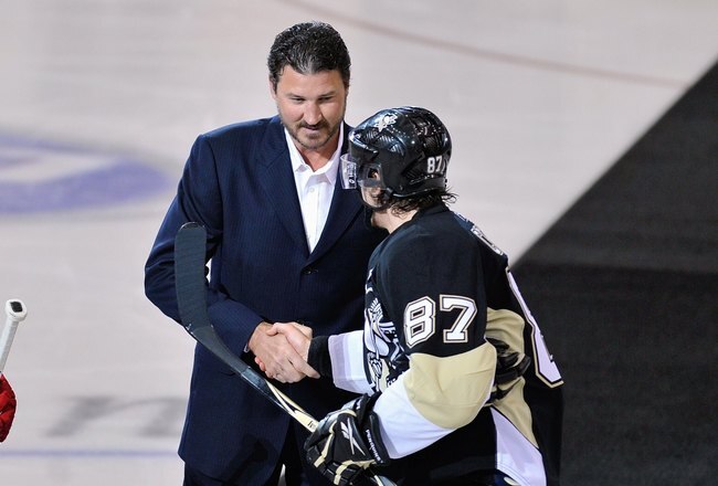 PITTSBURGH - JUNE 02:  Sidney Crosby #87 of the Pittsburgh Penguins shakes hands with Co-Owner and Chairman of the Pittsburgh Penguins Mario Lemieux as Nicklas Lidstrom #5 of the Detroit Red Wings looks on before Game Three of the 2009 NHL Stanley Cup Finals on June 2, 2009 at Mellon Arena in Pittsburgh, Pennsylvania. (Photo by Jamie Sabau/Getty Images)