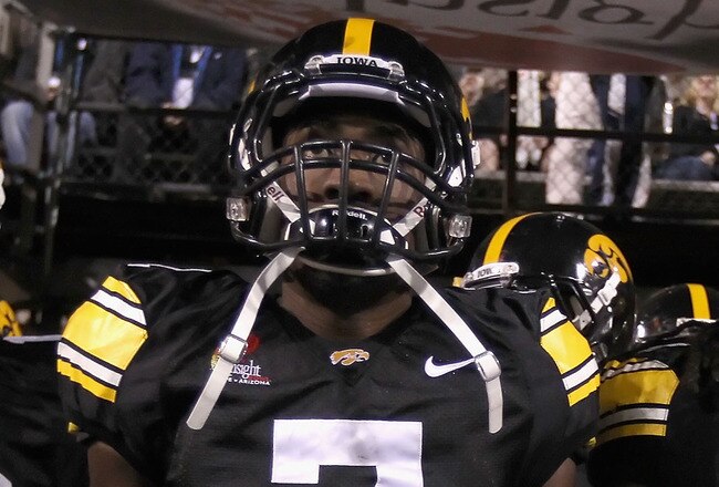 TEMPE, AZ - DECEMBER 28:  (L-R) Ricky Stanzi #12, Marvin McNutt #7 and Adrian Clayborn #94 of the Iowa Hawkeyes walk out onto the field for the Insight Bowl against the Missouri Tigers at Sun Devil Stadium on December 28, 2010 in Tempe, Arizona. The Hawkeyes defeated the Tigers 27-24.  (Photo by Christian Petersen/Getty Images)