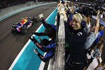 ABU DHABI, UNITED ARAB EMIRATES - NOVEMBER 14:  F1 2010 World Champion Sebastian Vettel of Germany and Red Bull Racing crosses the finishing line in front of team mates to win the Abu Dhabi Formula One Grand Prix at the Yas Marina Circuit on November 14, 2010 in Abu Dhabi, United Arab Emirates.  (Photo by Vladimir Rys/Getty Images)