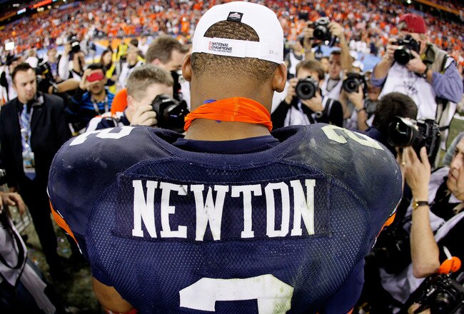 GLENDALE, AZ - JANUARY 10:  Quarterback Cameron Newton #2 of the Auburn Tigers celebrates the Tigers 22-19 victory against the Oregon Ducks in the Tostitos BCS National Championship Game at University of Phoenix Stadium on January 10, 2011 in Glendale, Arizona.  (Photo by Kevin C. Cox/Getty Images)