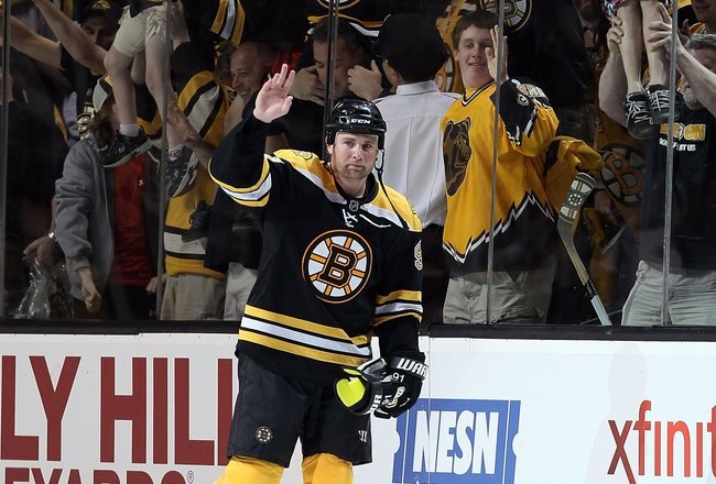 BOSTON - MAY 01:  Marc Savard #91 of the Boston Bruins salutes the cheering fans after the game against the Philadelphia Flyers in Game One of the Eastern Conference Semifinals during the 2010 NHL Stanley Cup Playoffs at TD Garden on May 1, 2010 in Boston, Massachusetts. The Bruins defeated the Flyers 5-4 in overtime.  (Photo by Elsa/Getty Images)