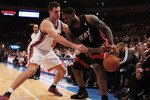 NEW YORK, NY - DECEMBER 17:  Danilo Gallinari #8 of the New York Knicks knocks the ball out of the hands of LeBron James #6 of the Miami Heat at Madison Square Garden on December 17, 2010 in New York City. NOTE TO USER: User expressly acknowledges and agrees that, by downloading and or using this Photograph, user is consenting to the terms and condition of the Getty Images License Agreement.  (Photo by Al Bello/Getty Images)
