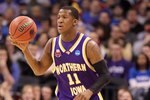 OKLAHOMA CITY - MARCH 20:  Kwadzo Ahelegbe #11 of the Northern Iowa Panthers brings the ball up court against the Kansas Jayhawks during the second round of the 2010 NCAA men's basketball tournament at Ford Center on March 20, 2010 in Oklahoma City, Oklahoma.  (Photo by Ronald Martinez/Getty Images)