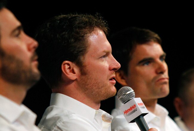 CONCORD, NC - JANUARY 26:  Dale Earnhardt Jr. (2L), driver of the #88 AMP Energy Chevrolet, speaks to the media during the NASCAR Sprint Media Tour hosted by Charlotte Motor Speedway, held at Hendrick Motorsports on January 26, 2011 in Concord, North Carolina.  (Photo by Jason Smith/Getty Images for NASCAR)