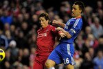 LIVERPOOL, ENGLAND - NOVEMBER 07:  John Terry of Chelsea is unable to stop Fernando Torres of Liverpool scoring the opening goal during the Barclays Premier League match between Liverpool and Chelsea at Anfield on November 7, 2010 in Liverpool, England.  (Photo by Shaun Botterill/Getty Images)