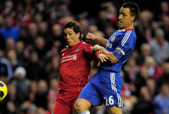 LIVERPOOL, ENGLAND - NOVEMBER 07:  John Terry of Chelsea is unable to stop Fernando Torres of Liverpool scoring the opening goal during the Barclays Premier League match between Liverpool and Chelsea at Anfield on November 7, 2010 in Liverpool, England.  (Photo by Shaun Botterill/Getty Images)