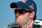 HOMESTEAD, FL - NOVEMBER 21:  Dale Earnhardt Jr., driver of the #88 National Guard/AMP Energy Chevrolet, stands on pit road prior to the NASCAR Sprint Cup Series Ford 400 at Homestead-Miami Speedway on November 21, 2010 in Homestead, Florida.  (Photo by Chris Graythen/Getty Images)