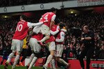LONDON, ENGLAND - JANUARY 25:  Laurent Koscielny of Arsenal celebrates with team mates as he scores their second goal during the Carling Cup Semi Final Second Leg match between Arsenal and Ipswich Town at Emirates Stadium on January 25, 2011 in London, England.  (Photo by Shaun Botterill/Getty Images)