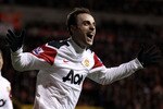 BLACKPOOL, ENGLAND - JANUARY 25:   Dimitar Berbatov of Manchester United celebrates scoring his team's third goal during the Barclays Premier League match between Blackpool and Manchester United at Bloomfield Road on January 25, 2011 in Blackpool, England. (Photo by Alex Livesey/Getty Images)