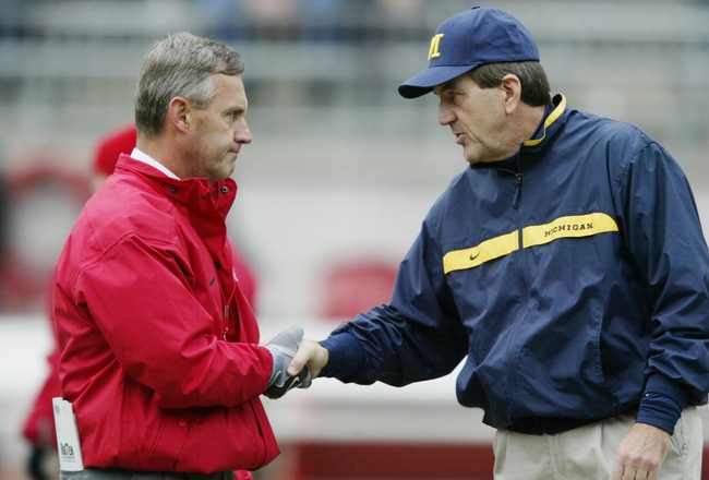 COLUMBUS, OH - NOVEMBER 23:  Jim Tressel of Ohio State shakes hands with Lloyd Carr of Michigan prior to their game on November 23, 2002 at Ohio Stadium in Columbus, Ohio.  Ohio State won the game, 14-9. (Photo by Tom Pidgeon/Getty Images)