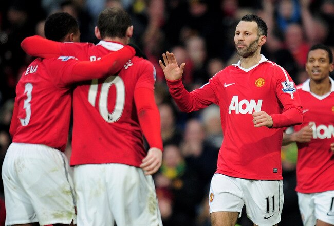 MANCHESTER, ENGLAND - JANUARY 22:  Ryan Giggs of Manchester United celebrates scoring his team's third goal with his team mates during the Barclays Premier League match between Manchester United and Birmingham City at Old Trafford on January 22, 2011 in Manchester, England.  (Photo by Shaun Botterill/Getty Images)