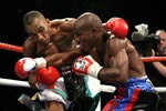 NOTTINGHAM, ENGLAND - MAY 10:  Timothy Bradley (L) connects with a right cross on Junior Witter during their WBC Light Welterweight fight on May 10, 2008 at Nottingham Ice Arena in Nottingham, England. (Photo by John Gichigi/Getty Images)