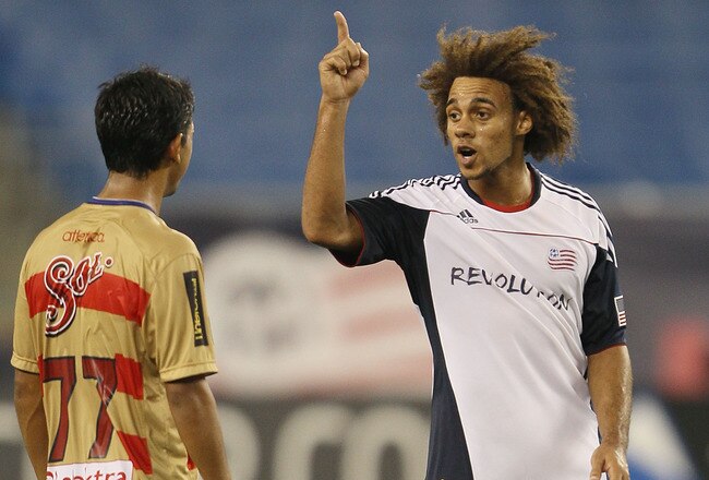 FOXBORO, MA - SEPTEMBER 01:  Kevin Alston #30 of the New England Revolution has words with Elias Hernan #77 of Monarcas Morelia during the SuperLiga 2010 championship game on September 1, 2010 at Gillette Stadium in Foxboro, Massachusetts. Monarcas Morelia defeated the Revolution 2-1 to win the SuperLiga 2010 title.  (Photo by Elsa/Getty Images)