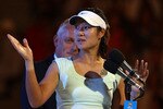 MELBOURNE, AUSTRALIA - JANUARY 29:  Na Li of China speaks to the crowd after losing her women's final match against Kim Clijsters of Belgium during day thirteen of the 2011 Australian Open at Melbourne Park on January 29, 2011 in Melbourne, Australia.  (Photo by Clive Brunskill/Getty Images)