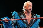 PERTH, AUSTRALIA - NOVEMBER 24:  Rick Flair looks on while awaiting the entrance of Hulk Hogan during the Hulkamania Tour at the Burswood Dome on November 24, 2009 in Perth, Australia.  (Photo by Paul Kane/Getty Images)