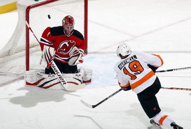 NEWARK, NJ - JANUARY 06: Scott Hartnell #19 of the Philadelphia Flyers shoots wide of Johan Hedberg #1 of the New Jersey Devils at the Prudential Center on January 6, 2011 in Newark, New Jersey.  (Photo by Bruce Bennett/Getty Images)