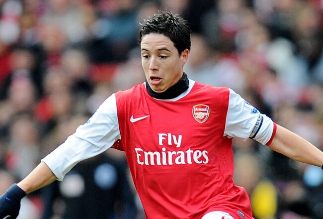 LONDON, ENGLAND - JANUARY 30:  Samir Nasri of Arsenal goes past Gary Roberts of Huddersfield during the FA Cup sponsored by E.ON fourth round match between Arsenal and Huddersfield Town at The Emirates Stadium on January 30, 2011 in London, England.  (Photo by Clive Mason/Getty Images)