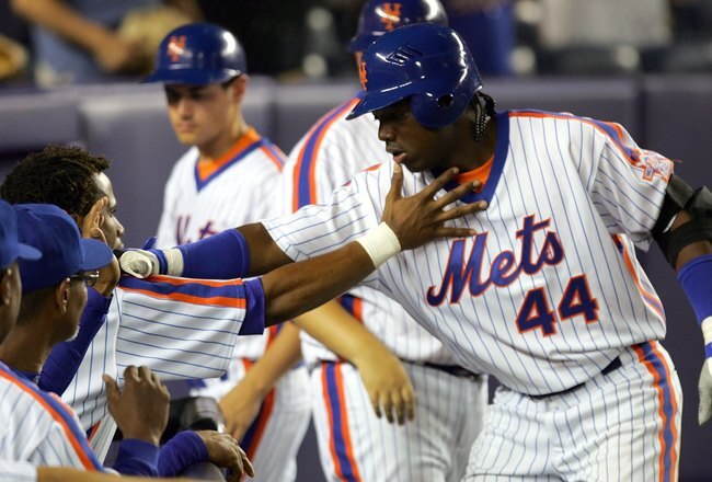 NEW YORK - AUGUST 19:  Lastings Milledge #44 of the New York Mets is congratulated by his teammates on his 8th inning home run against the Colorado Rockies at Shea Stadium August 19, 2006 in the Queens borough of New York City. The Mets defeated the Rockies 7-4.  (Photo by Chris Trotman/Getty Images)