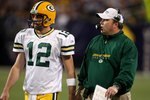MINNEAPOLIS - NOVEMBER 09:  Quarterback Aaron Rodgers #12 and head coach Mike McCarthy of the Green Bay Packers confer against the Minnesota Vikings on November 9, 2008 at the Metrodome in Mineapolis, Minnesota.  The Vikings won 28-27.  (Photo by Stephen Dunn/Getty Images)