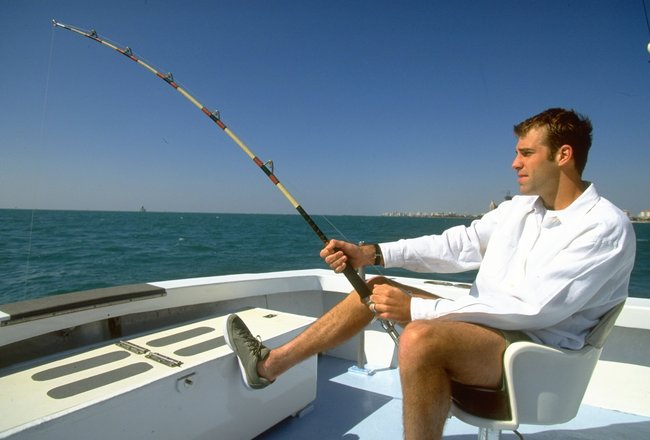 Mar 1996:  Greg Rusedski of Great Britain tries his hand at deep sea fishing off the Miami Coast during the Lipton Championships in Florida, USA. \ Mandatory Credit: Clive  Brunskill/Allsport