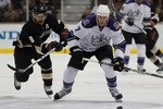 ANAHEIM, CA - NOVEMBER 29:  Rob Scuderi #7 of the Los Angeles Kings is pursued by Teemu Selanne #8 of the Anaheim Ducks during the third period at the Honda Center on November 29, 2010 in Anaheim, California. The Ducks defeated the Kings 2-0.  (Photo by Jeff Gross/Getty Images)