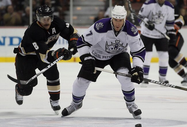 ANAHEIM, CA - NOVEMBER 29:  Rob Scuderi #7 of the Los Angeles Kings is pursued by Teemu Selanne #8 of the Anaheim Ducks during the third period at the Honda Center on November 29, 2010 in Anaheim, California. The Ducks defeated the Kings 2-0.  (Photo by Jeff Gross/Getty Images)
