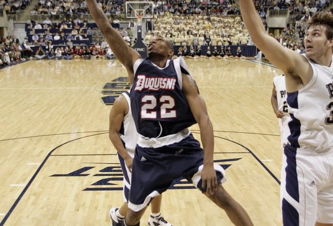 PITTSBURGH - DECEMBER 6: Gary Tucker #22 of the Duquesne Dukes makes a layup during a game against the Pittsburgh Panthers on December 6, 2006 at the Petersen Events Center in Pittsburgh, Pennsylvania. Pittsburgh defeated Duquesne, 73-56. (Photo by Gregory Shamus/Getty Images)