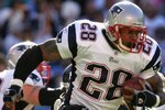 SAN DIEGO - JANUARY 14:  Runningback Corey Dillon #28 of the New England Patriots carries the ball against the San Diego Chargers during the AFC Divisional Playoff Game held on January 14, 2007 at Qualcomm Stadium in San Diego, California.  (Photo by Stephen Dunn/Getty Images)