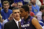 LAWRENCE, KS - JANUARY 29:  Head coach Frank Martin of the Kansas State Wildcats glares at Shane Southwell #1 during the game against the Kansas Jayhawks on January 29, 2011 at Allen Fieldhouse in Lawrence, Kansas.  (Photo by Jamie Squire/Getty Images)